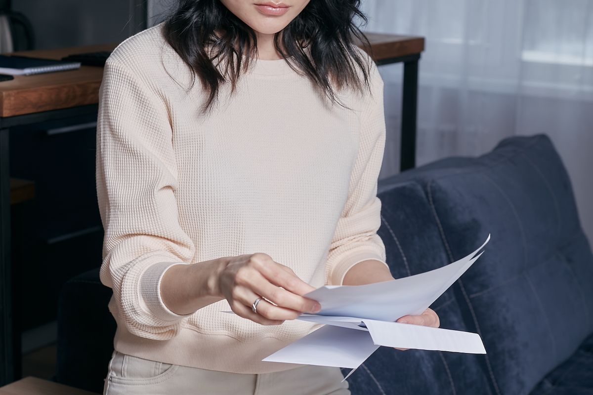 A property owner reviewing their owner statements at home