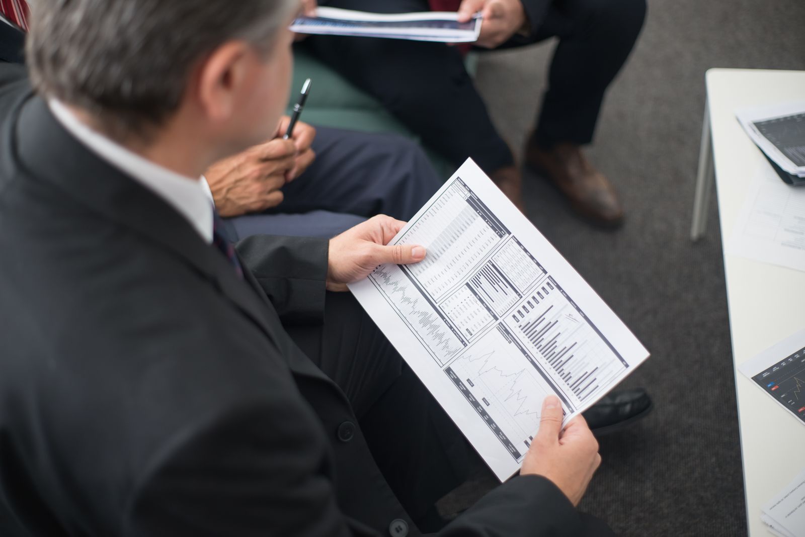 Professionals reviewing property management and accounting reports