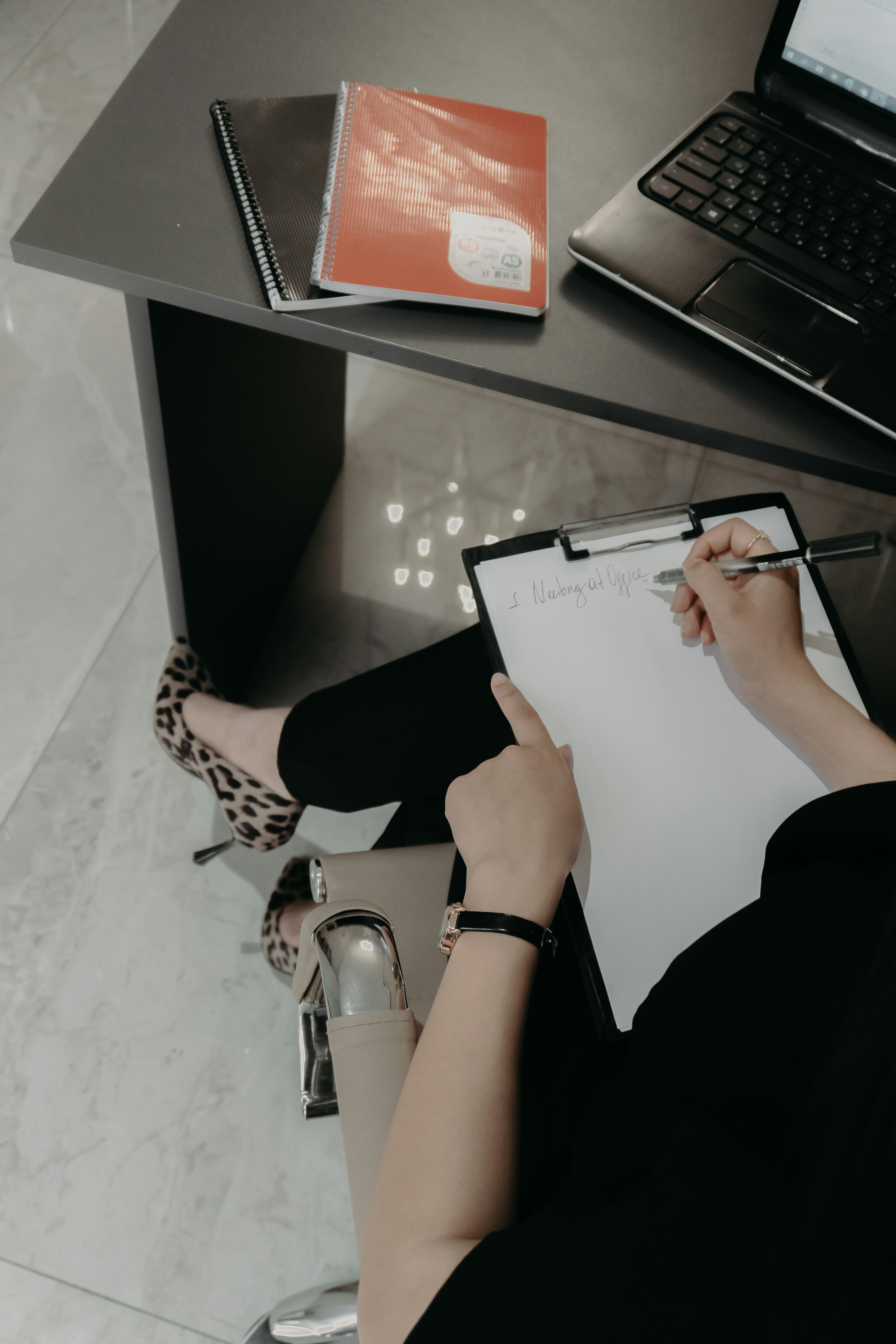 A property management bookkeeper reviewing monthly financial reports