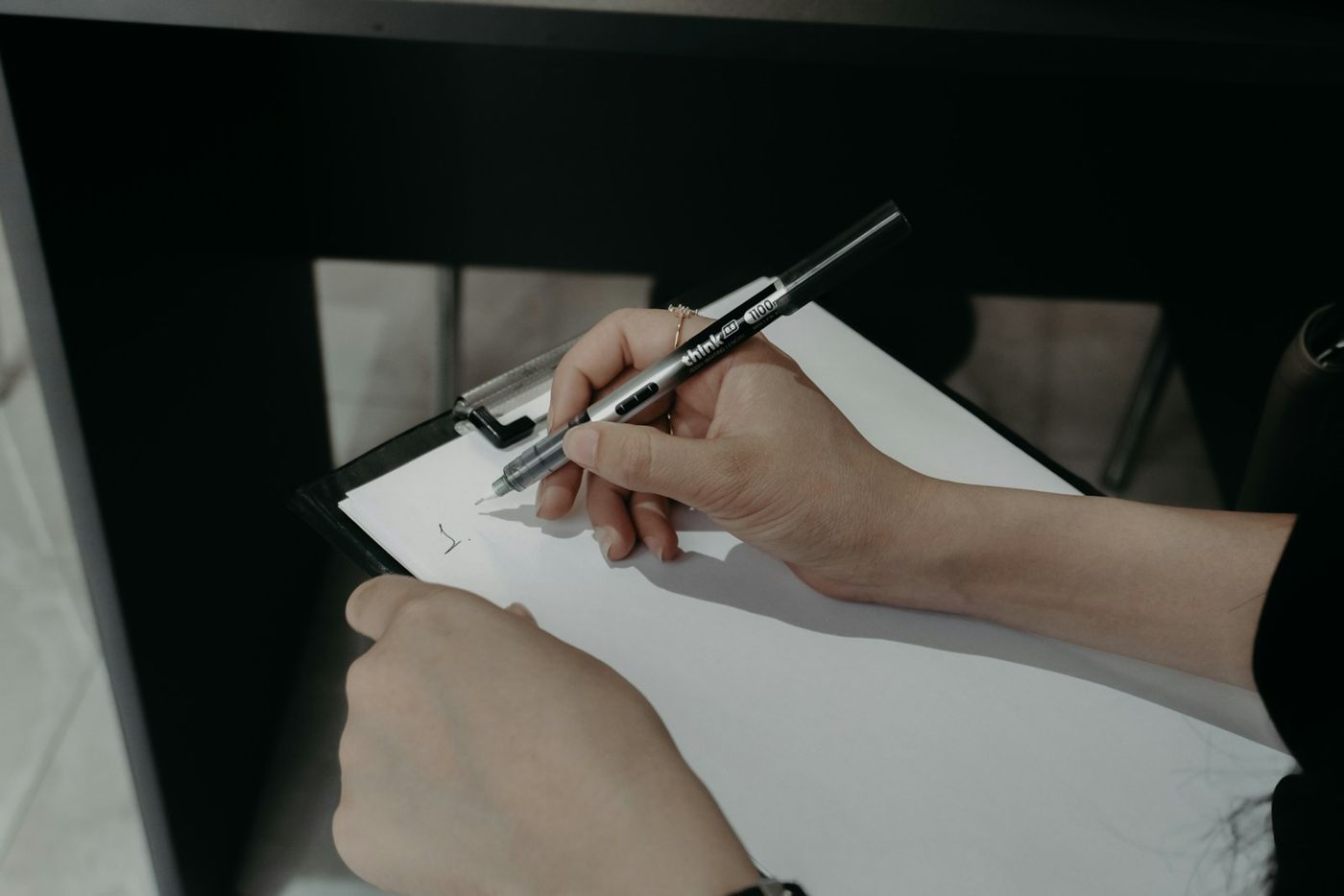 Property manager reviewing a rent roll on a clipboard