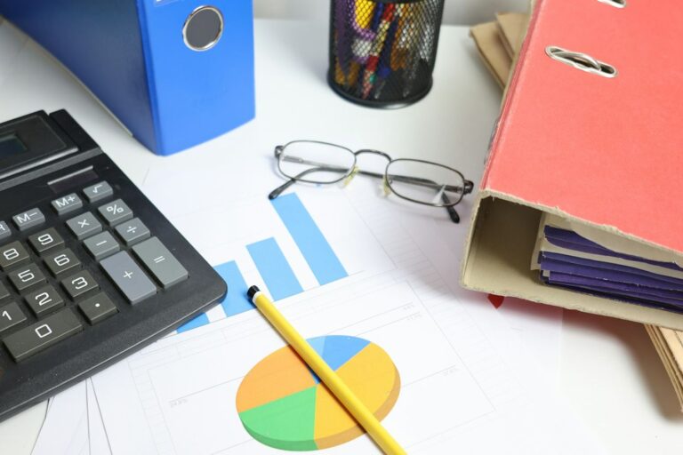 Calculator, charts and folders for rental income tax records
