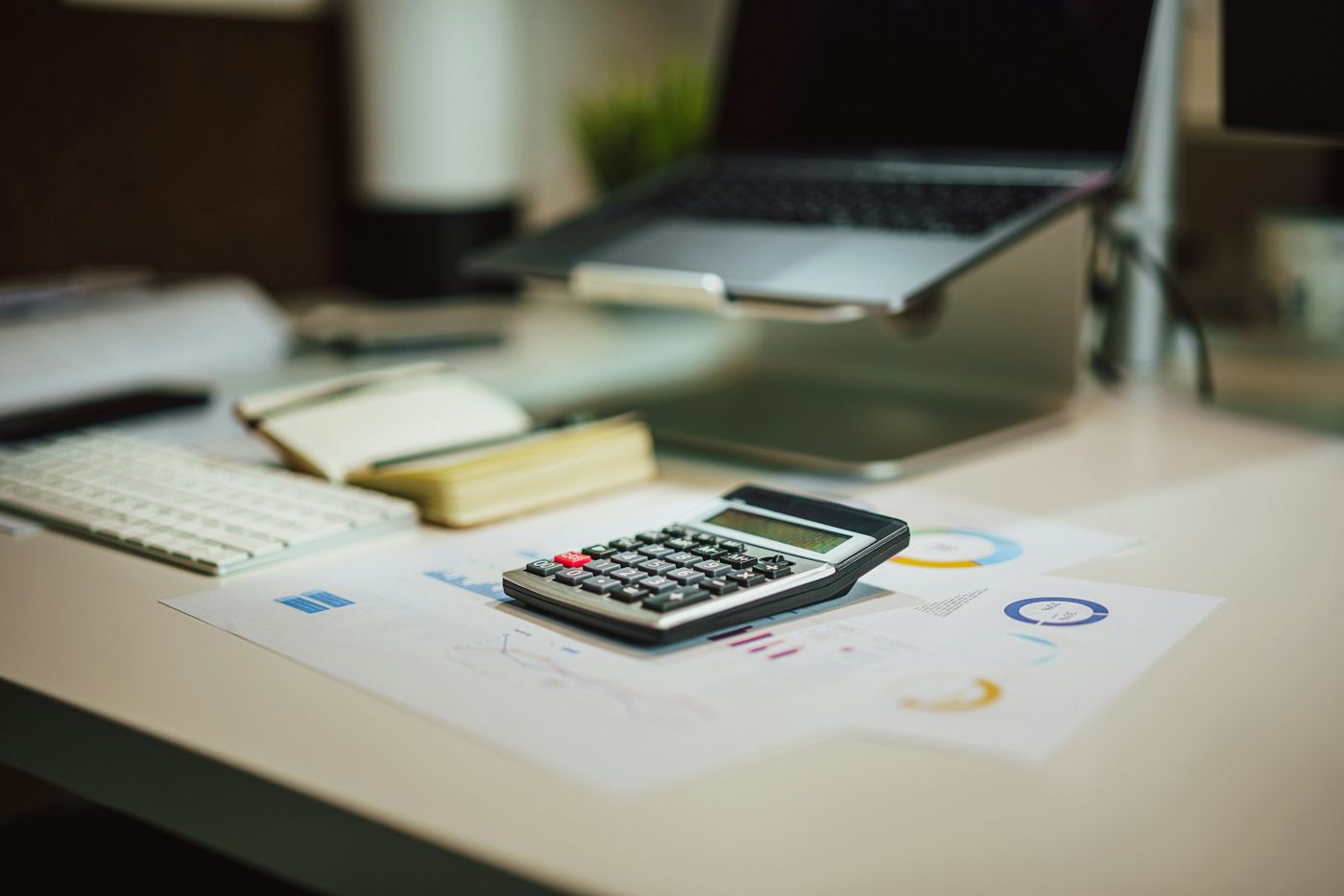 Calculator and laptop for rental property bonus depreciation planning