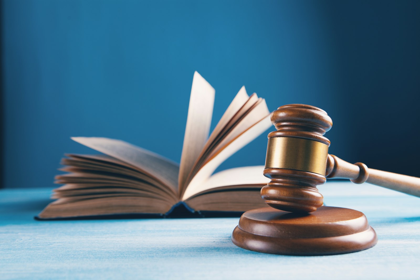 Gavel and law book representing trust accounting rules for property managers